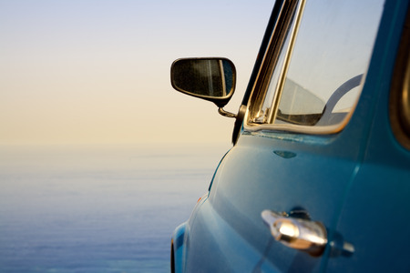 travel destination: vintage car parked near the sea
