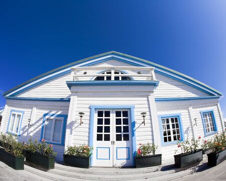 home sweet home: white house against a blue skyの写真素材