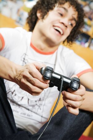 playing video games: guy feet crossed on the bed having fun with his brand new videogame