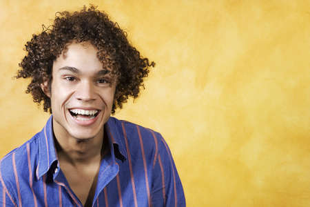 facial expressions: guy with curly hair smiling
