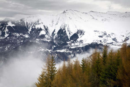 winter scene: french Alps on a foggy dayの写真素材