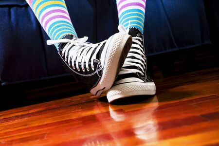 girl in a waiting room. Close up of her footwearの写真素材