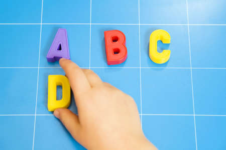 child learning the ABC's. The focus is on the letter Bの写真素材