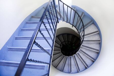 high angle view of old spiral staircaseの写真素材