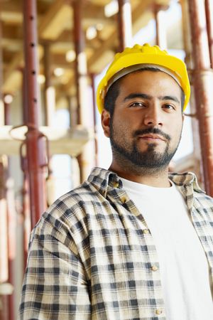 Portrait of latin american construction worker looking at camera. Copy spaceの写真素材