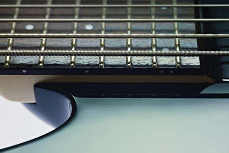 closeup of five cords electric bass and fretboard. Horizontal shape, studio shot, copy spaceの写真素材