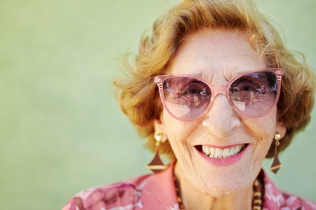 portrait of happy senior caucasian woman looking at camera and smiling. Horizontal shape, copy spaceの写真素材