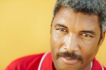50 years old latin american man looking at camera with intense stare. Head and shoulders, copy spaceの写真素材