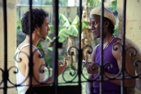 Drug addicted man buying heroine dose from african american pusherの写真素材