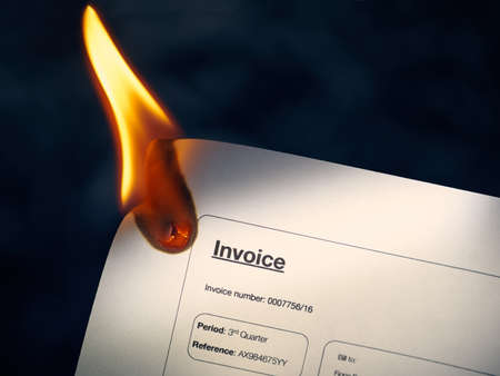 Close-up of bill document burning. Concept shot of freedom and new beginnings.