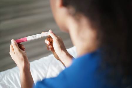 Woman Holding Negative Pregnancy Test Kitの写真素材