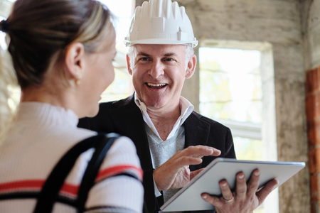 Woman Buying New Home And Talking To Brokerの写真素材