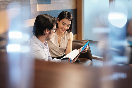 Business Man And Woman Meeting At Work In Office Cafeteriaの写真素材