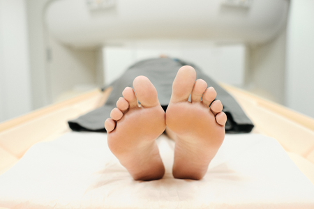 Mature Patient With Health Problems Doing MRI In Medical Centerの写真素材