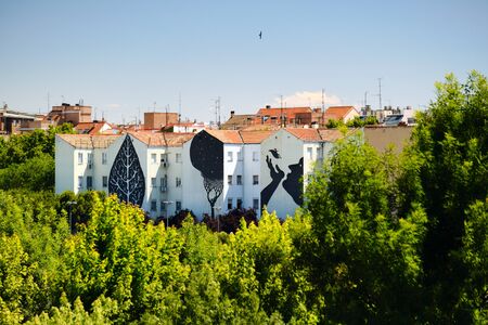Graffiti and Paintings on House Buildings Near Puente de Toledo in Madridのeditorial素材