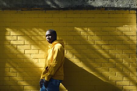 African Male Immigrant Looks At Camera With Serious Expressionの写真素材