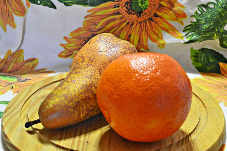 mixed fruits on white tablecloth flowersの写真素材
