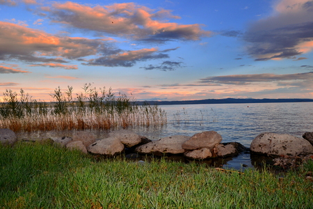 Bolsena lake at sunsetの写真素材