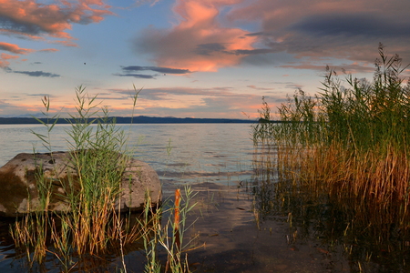 Bolsena lake at sunsetの写真素材