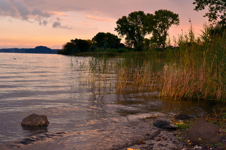Bolsena lake at sunsetの写真素材