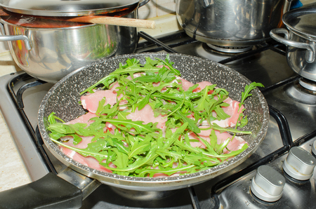 fettine di maiale con con rucola e pepe neroの写真素材