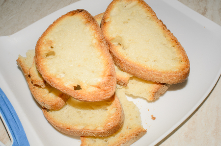 slices of toast on a white trayの写真素材