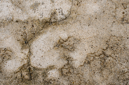 details of an old plastered wall damaged by timeの写真素材