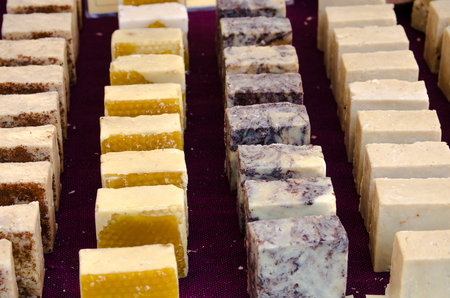 display of handmade soap cubes in a stand of a flea marketの写真素材