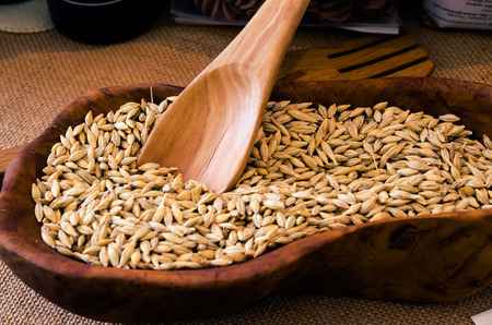 an ancient variety of durum wheat for pasta in an olive wood bowlの写真素材