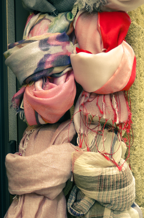 collection of scarves in different colors on display in a shopの写真素材