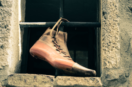 antique style footwear in a shoe craftsman's workshopの写真素材