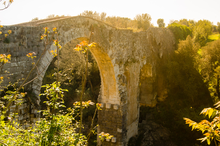 bridge of the abbey, on the Fiora river also called the devil's bridgeの写真素材