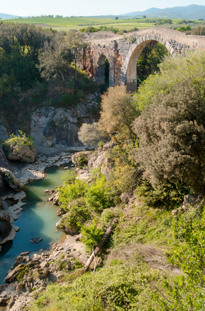 bridge of the abbey, on the Fiora river also called the devil's bridgeの写真素材
