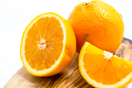 Sliced oranges isolated on white backgroundの写真素材
