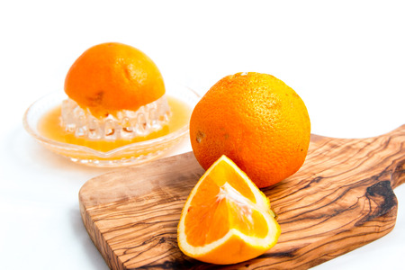 Sliced oranges isolated on white backgroundの写真素材