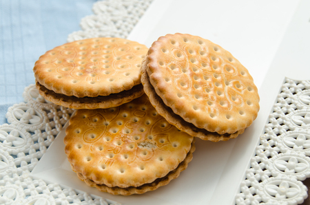 Italian breakfast with a cup of coffee and chocolate-filled biscuitsのeditorial素材
