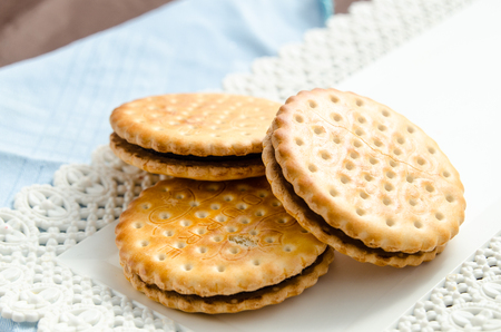 Italian breakfast with a cup of coffee and chocolate-filled biscuitsの写真素材