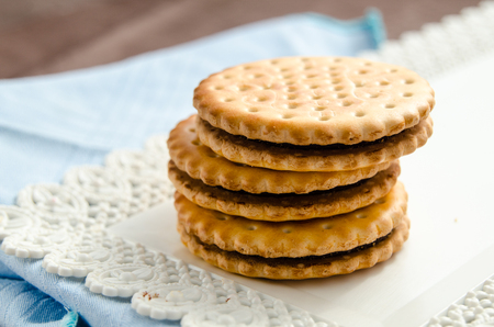 Italian breakfast with a cup of coffee and chocolate-filled biscuitsの写真素材
