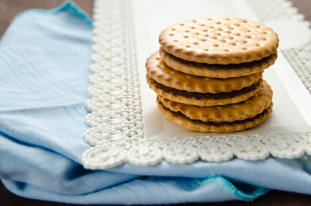 Italian breakfast with a cup of coffee and chocolate-filled biscuitsの写真素材