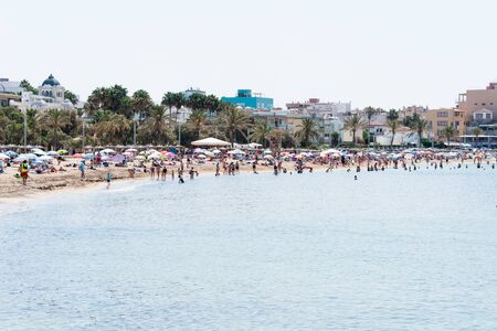 Beach with people and sea landscape in Majorcaの写真素材