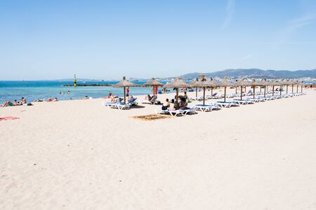 Beach with people and sea landscape in Ciudad Jardin, Majorcaの写真素材