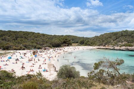 Beach with people and sea landscape in Santanyi, Majorca