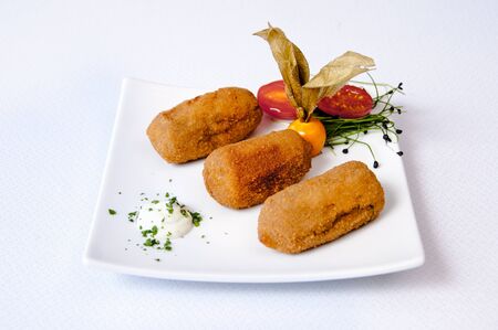 Croquettes plate on a white background
