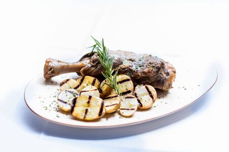 A plate of meat on a white backgroundの写真素材