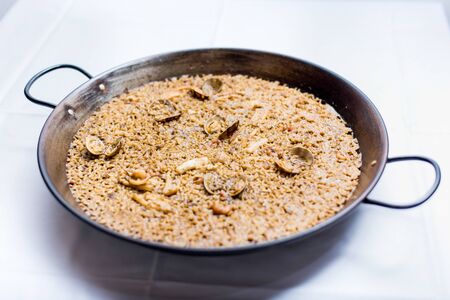 Presentation of hot and ready-to-eat paellaの写真素材