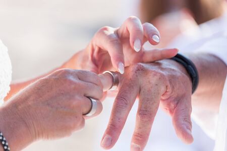 Wedding engagement rings in handsの写真素材