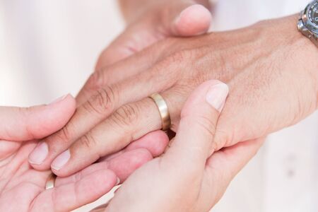 Wedding engagement rings in handsの写真素材