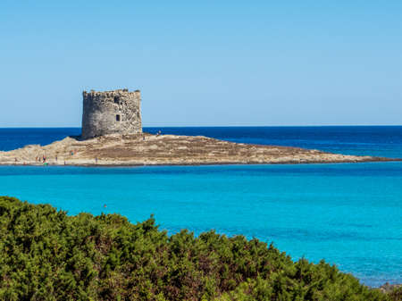 La Pelosa Beach in Stintino, Sardinia, Italy. In the background, the landmark 16th century La Pelosa Tower (Italian: Torre della Pelosa).のeditorial素材