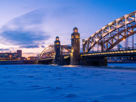 Bolsheokhtinsky Bridge with the frozen Neva River. In St. Petersburg, Russiaの写真素材
