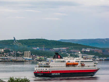 TROMSO, NORWAY - JULY 5, 2010: The Hurtigruten, a Norwegian cruise, ferry and cargo operator traveling from the south to the north coast of Norway.のeditorial素材